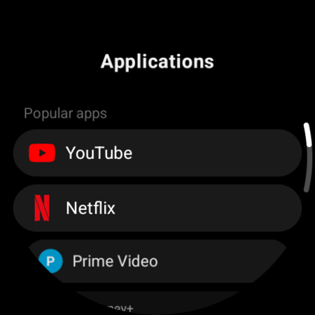 Applications list on a WearOS watch — YouTube, Netflix, Prime Video and other TV apps ready to be mapped to a button